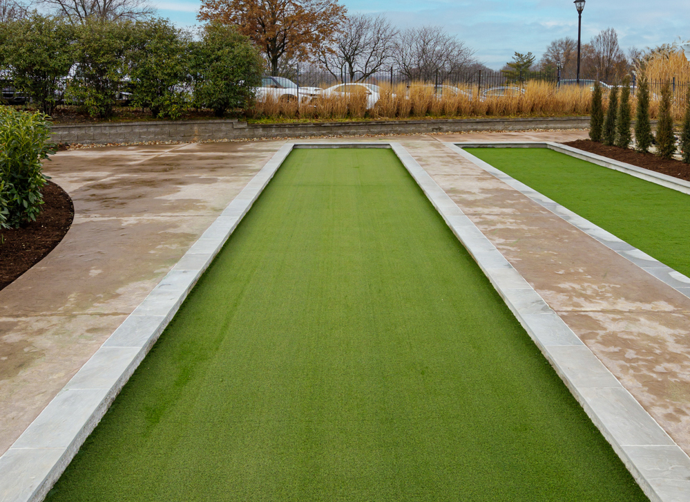 Artificial turf bocce court with concrete base