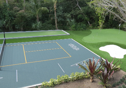Bring the Fun Home backyard with VersaCourt multi-sport game court, turf bocce court, and turf putting green with sand bunker