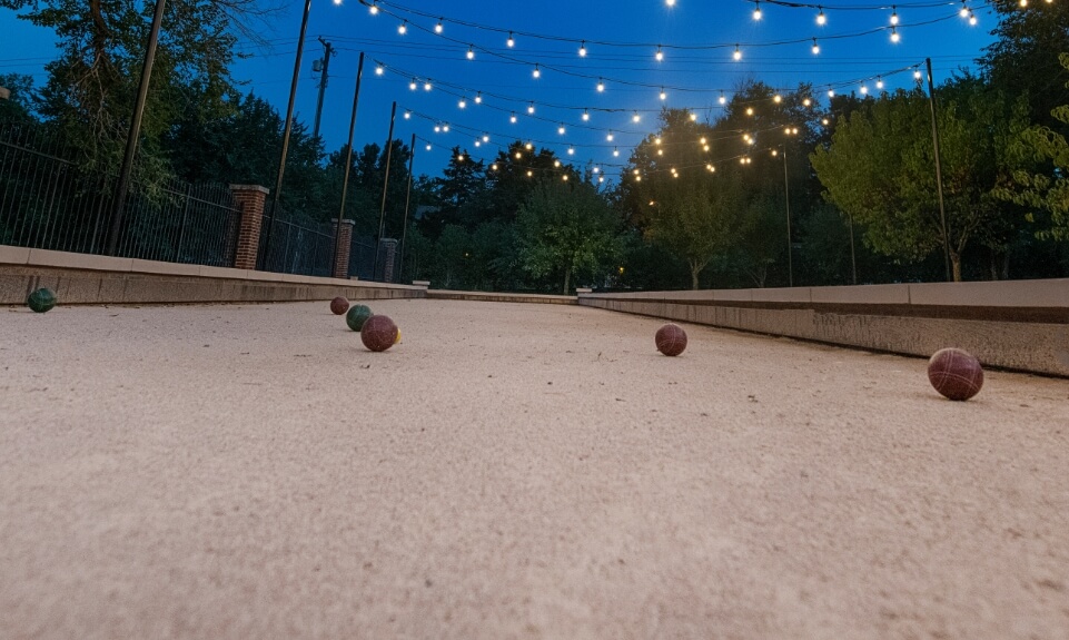 a raised border bocce court with loose fill