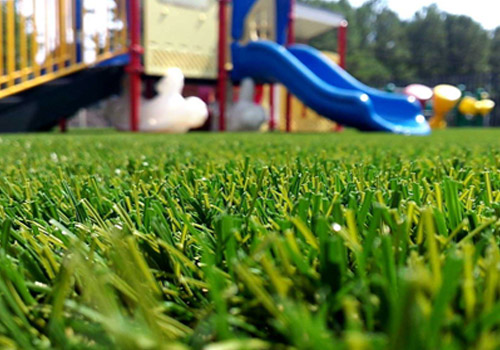 Synthetic turf playground surfacing