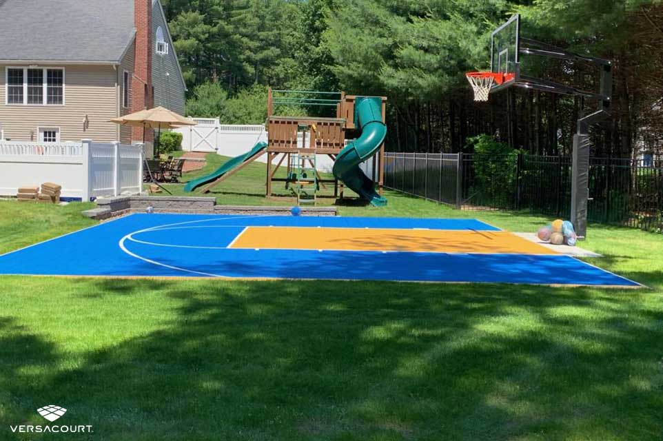 Backyard playground featuring a VersaCourt basketball court