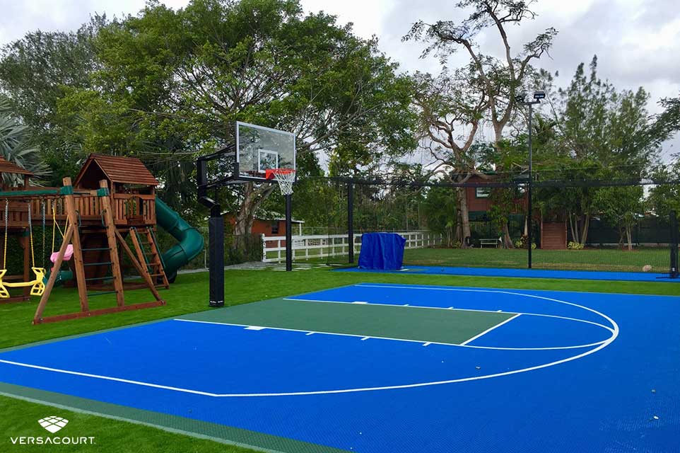 Backyard basketball court surrounded with XGrass synthetic turf