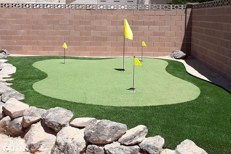 Small backyard with a practice putting green installed