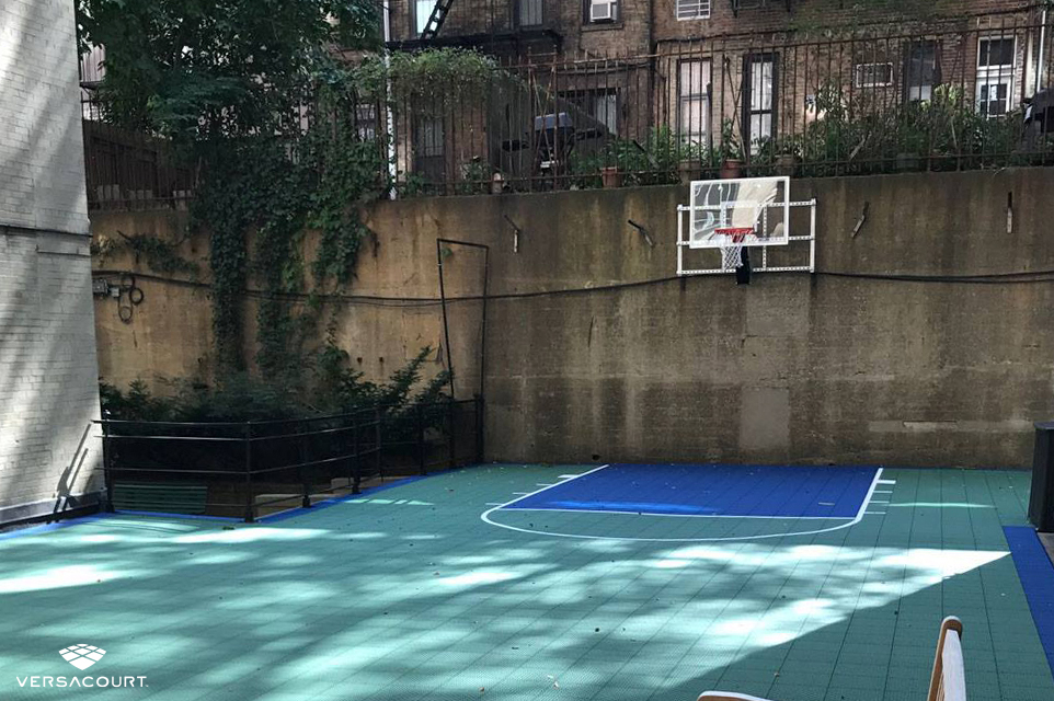 Small backyard in the city with a Versacourt basketball court installed