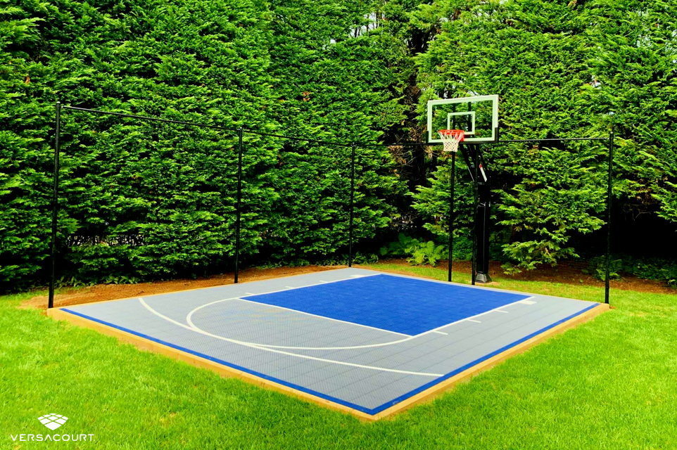 VersaCourt Half-court basketball court installed in a small backyard