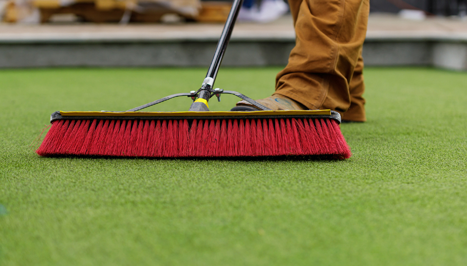 push broom maintenance on short artificial turf