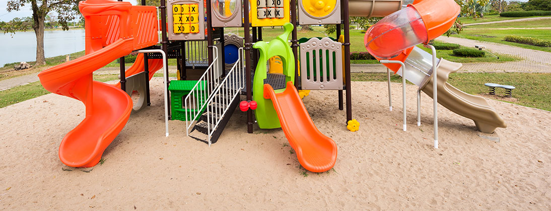commercial playground with sand surfacing