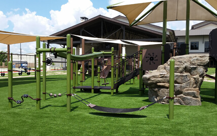 XGrass synthetic grass installed for this playground's flooring